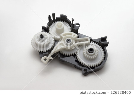 inkjet printer paper feeder mechanical drive. four external spur gear wheels, with different gear ratios. reducer of plastic cogwheels. with clipping path 126328400