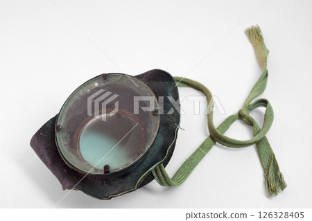 vintage leather safety glasses with ropes for tying at back of the head. with clipping path vintage leather safety glasses with ropes for tying at back of the head. with clipping path 126328405