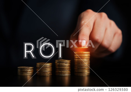 ROI ,Financial growth represented by rising stacks of gold coins in a modern urban cityscape, emphasizing profitability and investment metrics. 126329380