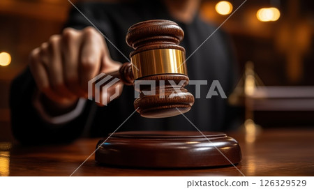 illustrator of Judge's hand holding a gavel to make a decision isolated white background. 126329529