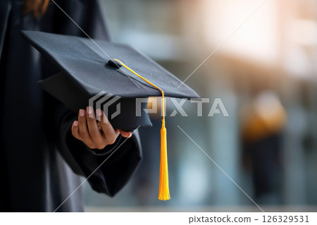 Close-up of the hand of the graduate on graduation day. 126329531