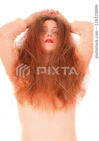 Mysterious woman with wild hair and red lips 126329806