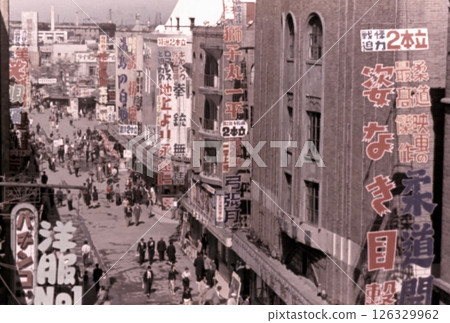 Old photo from 1956 in Tokyo, showing the entertainment district of Asakusa Roku-ku, lined with movie theaters 126329962
