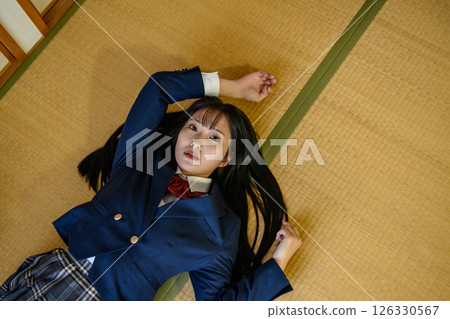 High school girl lying down in a Japanese-style room Education Career counseling SNS Daily life High school girl lying down in a Japanese-style room Education Career counseling SNS Daily life 126330567