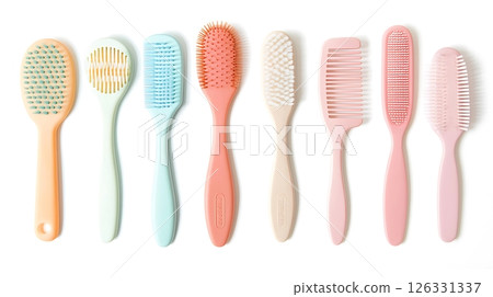 A row of six different colored hairbrushes 126331337