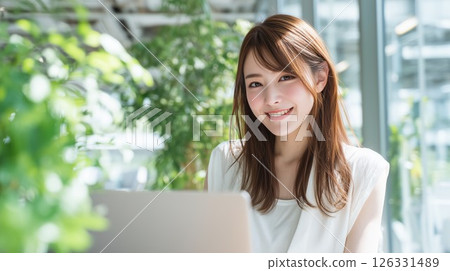 Woman working on a laptop Woman working on a laptop 126331489