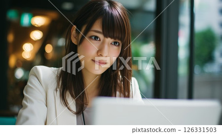 Woman working on a laptop 126331503