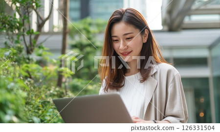 Woman working on a laptop Woman working on a laptop 126331504