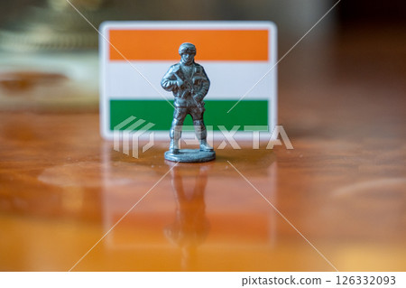 A tin soldier on the background of the Indian flag. India Pakistan military conflict A tin soldier on the background of the Indian flag. India Pakistan military conflict 126332093