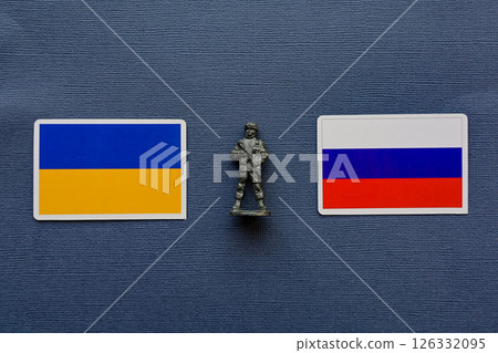Flags of Russia and Ukraine on a blue background. The Russian-Ukrainian conflict. 126332095