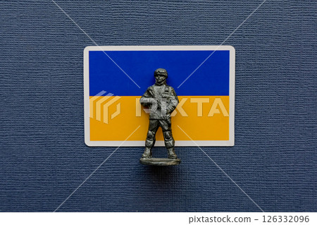 Flags of Ukraine on a blue background. The Russian-Ukrainian conflict. 126332096