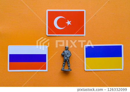 Flags of Russia, Ukraine and Turkey on a yellow background. The Russian-Ukrainian conflict. 126332099
