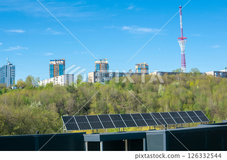 Solar panels installed on the roof of city building 126332544