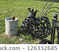 Close-Up of Crowned Metal Fish Sculpture on Artistic Bench 126332685