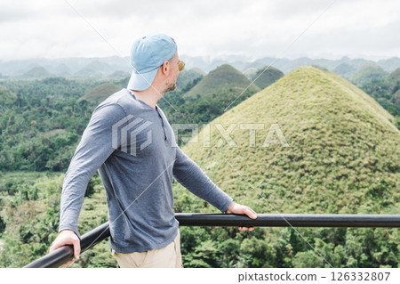 Handsome men against the backdrop of Chocolate Hills Handsome men against the backdrop of Chocolate Hills 126332807
