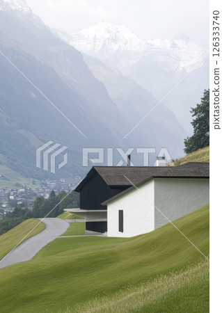 Scenic view of modern architecture in a mountainous landscape with lush greenery Scenic view of modern architecture in a mountainous landscape with lush greenery 126333740