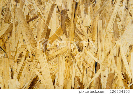 Abstract OSB texture with wood chips closeup for template, backdrop or web design. Natural background element for construction themes Abstract OSB texture with wood chips closeup for template, backdrop or web design. Natural background element for construction themes 126334103
