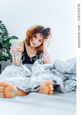 morning headache woman hangover 126334356