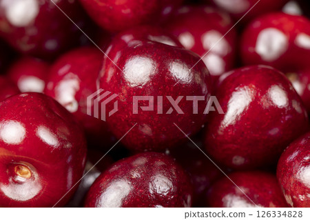 red cherry berries , red cherry fruits on the kitchen table closeup 126334828