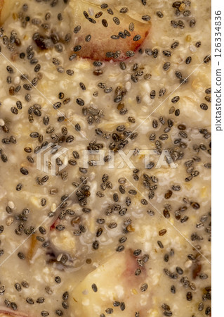 chia seeds in oatmeal with fruits, quickly cooked oatmeal porridge with fruits and berries and lots of chia seeds 126334836