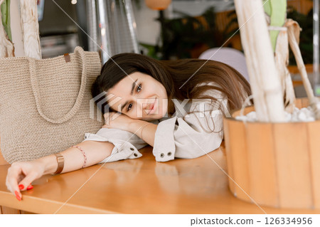 Portrait of dreaming attractive woman in cafe 126334956