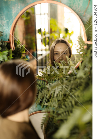 Captivating Reflections within a Lush Green Space Enhanced by Vibrant Indoor Plants Captivating Reflections within a Lush Green Space Enhanced by Vibrant Indoor Plants 126334974