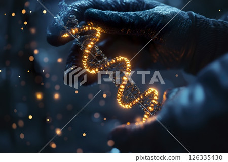 Person holding a glowing object in their hands with a dark background 126335430