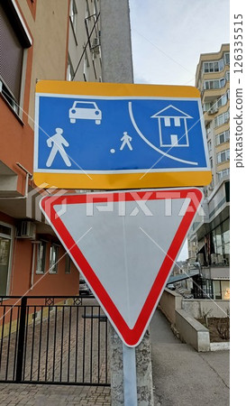 Warning Sign for Pedestrians and Vehicles Present in an Urban Setting for Safety Warning Sign for Pedestrians and Vehicles Present in an Urban Setting for Safety 126335515