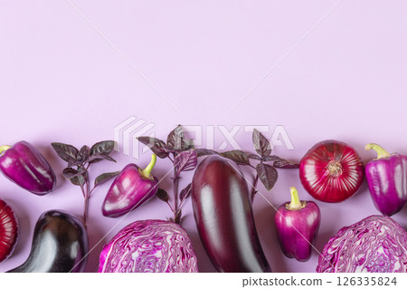 Composition of fresh vegetables eggplants, cabbage, pepper, onion and basil leaves of on pastel lilac lavender background. Creative food concept. Flat lay, top view. Composition of fresh vegetables eggplants, cabbage, pepper, onion and basil leaves of on pastel lilac lavender background. Creative food concept. Flat lay, top view. 126335824