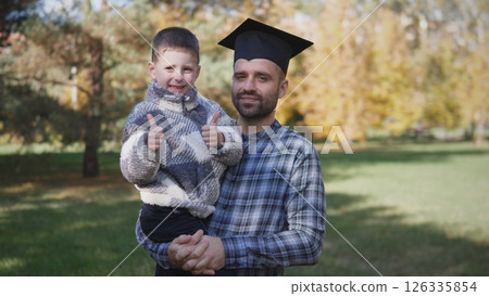 Joyful father portrait with a small child in a summer park 126335854
