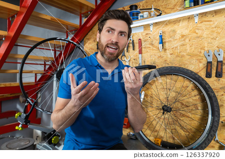 Mechanic sending voice note in workshop 126337920