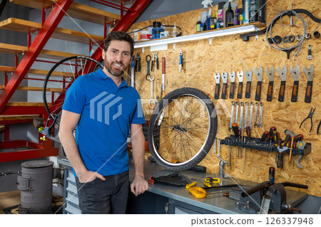 Mechanic posing in workshop Mechanic posing in workshop 126337948