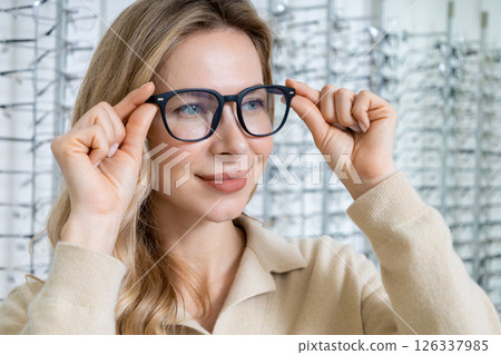 Pretty blonde caucasian woman in eyeglasses smiling nicely 126337985