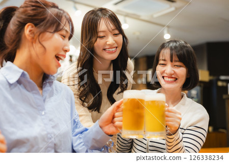 Women toasting at an izakaya Women toasting at an izakaya 126338234