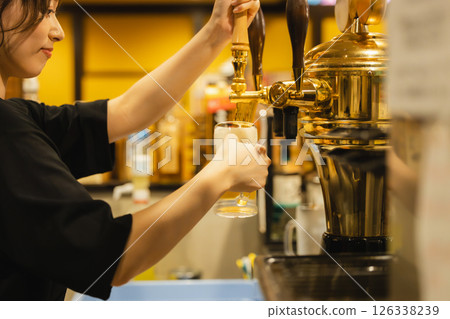Woman working at a bar 126338239