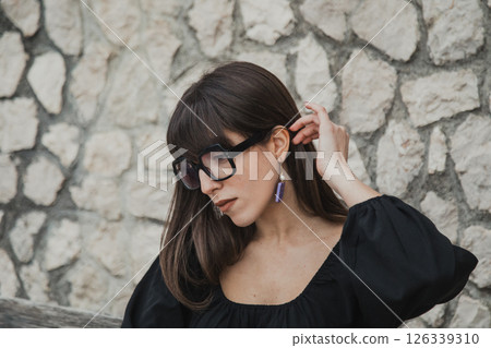 Pretty Young Woman With Eyeglasses watching Phone 126339310