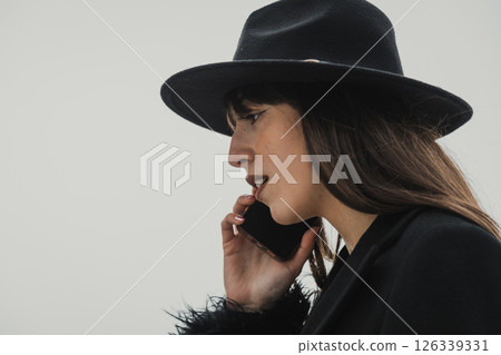 Elegant Woman In Total Black Walking With The Phone In The Town  126339331