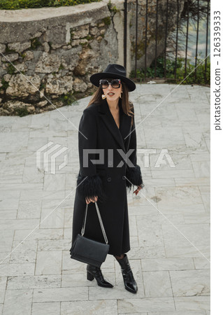 Woman Walking On The Stone Path Inside The Square Under The Castle 126339333