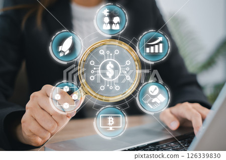 Businesswoman interacts with digital icons representing cryptocurrency and initial coin offerings, symbolizing modern financial technology. Businesswoman interacts with digital icons representing cryptocurrency and initial coin offerings, symbolizing modern financial technology. 126339830