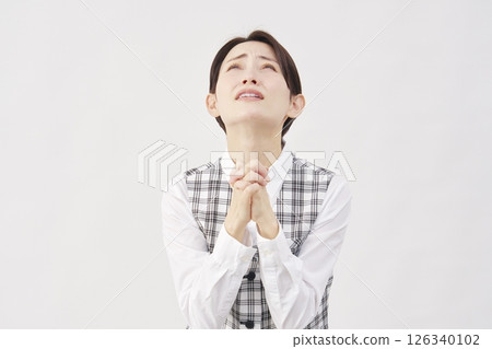 Female office worker pleading on white background Female office worker pleading on white background 126340102