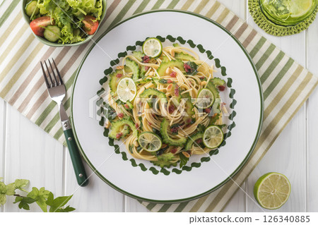 Bitter melon and plum pasta Bitter melon and plum pasta 126340885