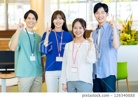 Young engineers working in an office. Photo courtesy of Denpa Gakuen, Tokyo Electronics College. 126340888