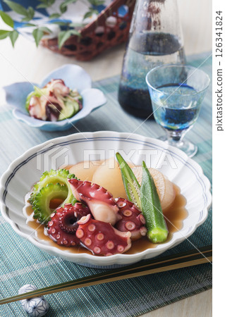 Softly simmered octopus and summer vegetables 126341824