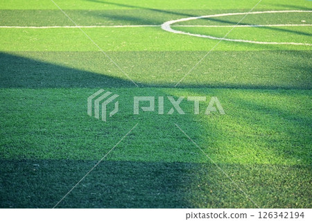 artificial green grass soccer field with sunlight, training football yard artificial green grass soccer field with sunlight, training football yard 126342194