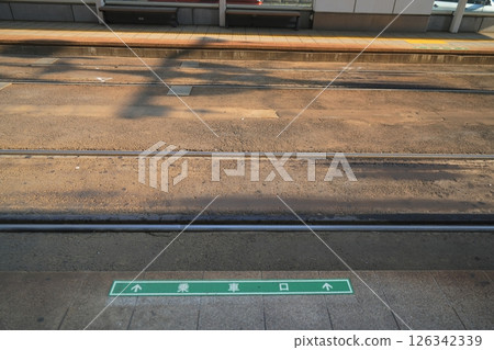 The tracks stretching out to the side as seen from the Sapporo tram platform 126342339