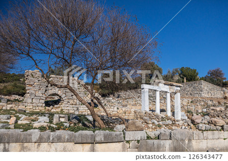 View of ancient Greek city Kaunos in Caria or Caunus in Roman period in Anatolia. Famous historical and archeological site. Popular place for family travel on summer vacation. Dalyan, Mugla Turkey View of ancient Greek city Kaunos in Caria or Caunus in Roman period in Anatolia. Famous historical and archeological site. Popular place for family travel on summer vacation. Dalyan, Mugla Turkey 126343477