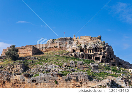 Acropolis, carved in rock tombs of ancient Greek city Tlos in Lycia located on Lycian way  Famous historical and archeological site. Popular place for family travel on summer vacation. Fethiye, Mugla, 126343480
