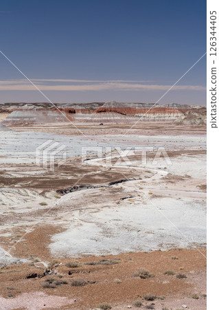Eroded Desert Landscape at Petrified Forest National Park Under Clear Blue Sky 126344405