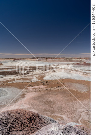 Eroded Desert Landscape at Petrified Forest National Park Under Clear Blue Sky 126344408
