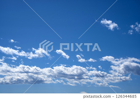 Clouds drifting in a clear sky Clouds drifting in a clear sky 126344685